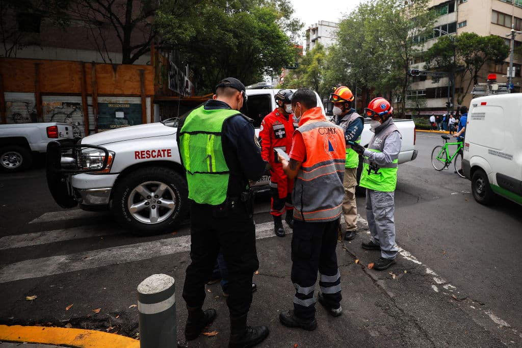 MEXICO CITY, MEXICO - JUNE 23: Civil Protection personnel and rescuers check for emergency calls after the earthquake on June 23, 2020 in Mexico City, Mexico. According to the National Seismological Service a 7.5 magnitude earthquake was registered on Tuesday in Mexico City and in various areas of the country. (Photo by Manuel Velasquez/Getty Images)